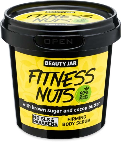 Ein schwarzer Behälter mit der Aufschrift 'Beauty Jar Fitness Nuts' mit gelbem und schwarzem Design, beworben wird ein Körperpeeling mit natürlichen Inhaltsstoffen.