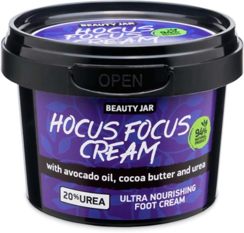 A purple and black jar of Hocus Focus Cream with avocado oil, cocoa butter, and urea for nourishing feet.