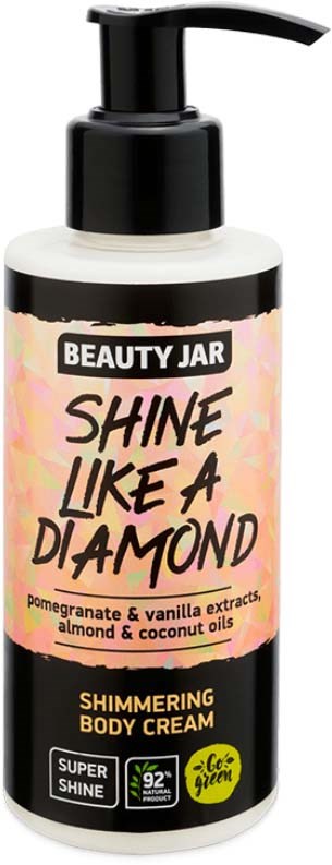 Eine weiße Flasche mit schwarzem Pumphahn, beschriftet 'Beauty Jar Shine Like a Diamond' mit Granatapfel, Vanille, Mandeln und Kokosölen.