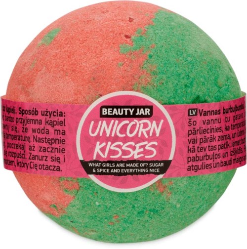 A round, colorful bath bomb with pink and green stripes and a label called 'Unicorn Kisses'.