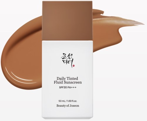 A sunscreen bottle with Korean characters, white and brown colors, and a smear of lotion around it.