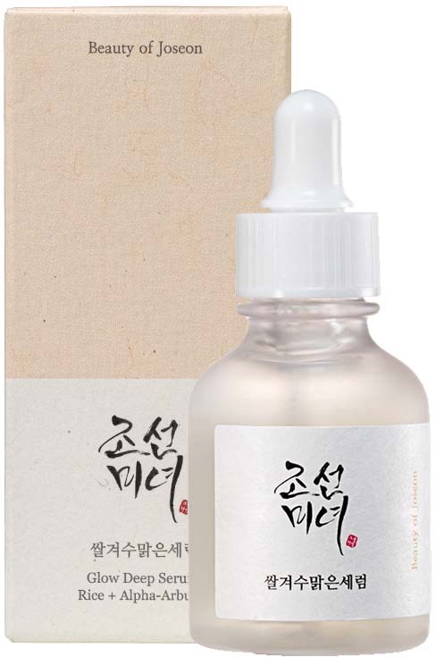 A small frosted glass bottle with a white dropper cap and a white box behind it. The box and bottle have Korean text.