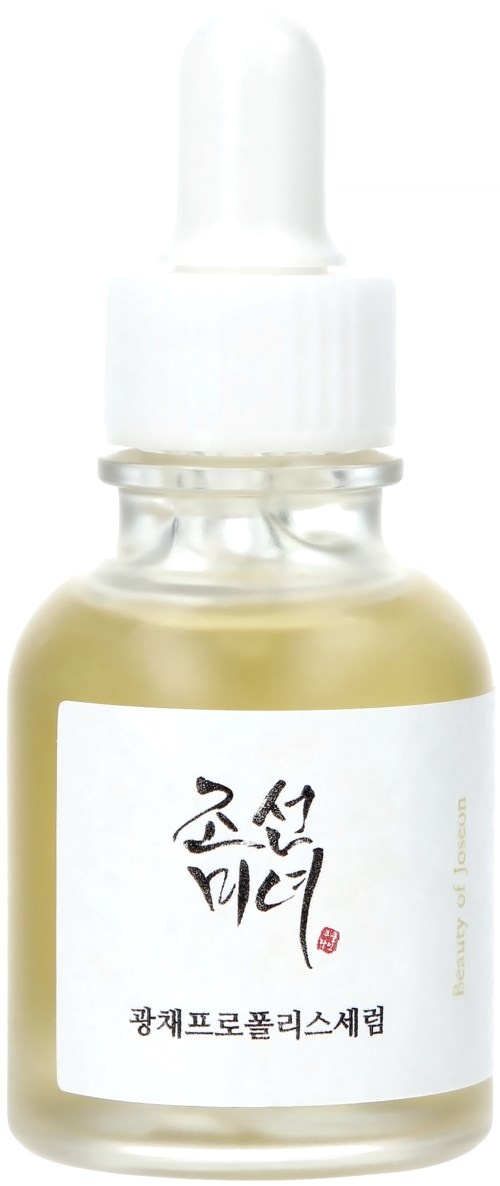 A small glass bottle with a dropper contains a yellowish liquid. The bottle has a label with Asian script.