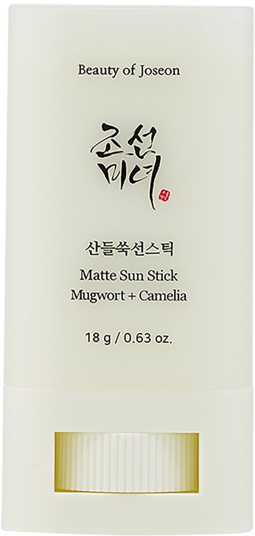 A white box contains a matte sun stick with a small opening at the bottom showing the stick.