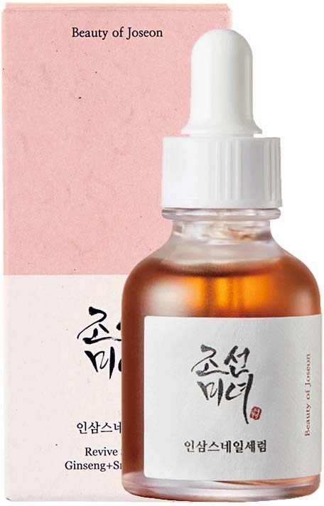 A small brown bottle with a white dropper cap and a label with Korean writing. It is in front of pink packaging.