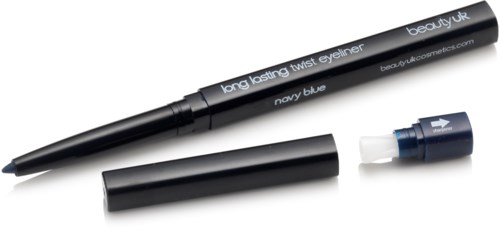 A navy blue twist eyeliner pen with a cap and a white tip, lying on a white surface.