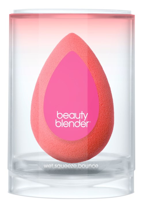 A pink makeup sponge called 'beauty blender' in a clear container, labeled 'wet squeeze bounce.'