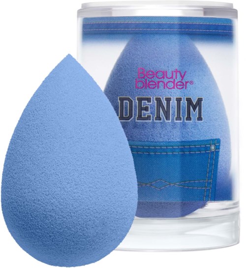A blue makeup sponge with a denim pocket design, labeled 'Beauty Blender Denim' in a clear plastic container.