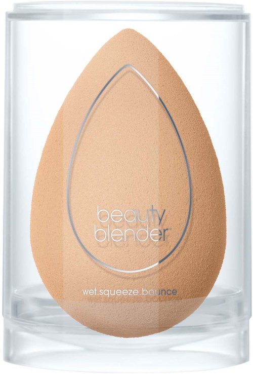 A beauty sponge inside a clear container, labeled 'beauty blender' and 'wet squeeze bounce.'