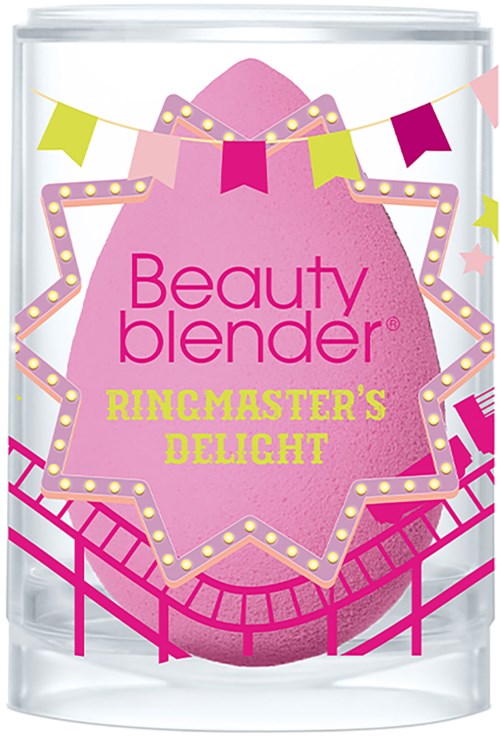 A pink beauty blender sponge with decorative stars and banners, labeled 'Beauty Blender Ringmaster's Delight'.
