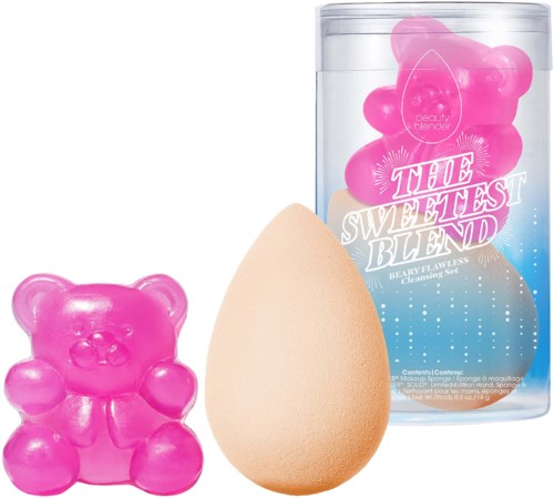 A pink bear-shaped soap, a makeup sponge, and a container with pink beauty blenders inside.