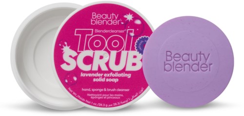 Circular soap container with purple soap and pink label, advertising lavender exfoliating scrub for hands and face.