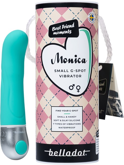 Kleiner türkisfarbener Vibrator namens Monica in Verpackung mit rosa, weißem und schwarzem Design, wasserfest und weich.