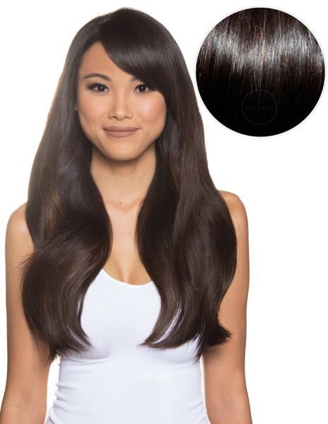 Een vrouw met lang, glanzend donker haar die glimlacht. Een cirkel toont een close-up van glanzend haar.
