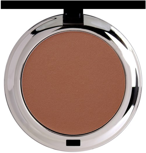 A round compact with brown pressed powder and a shiny silver edge, likely makeup.