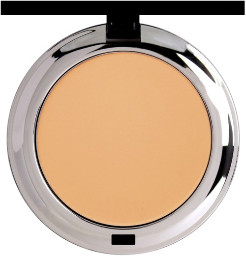 A round makeup compact with beige powder inside and a shiny silver lid.