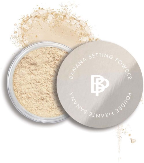 A container of banana setting powder with the lid showing the brand logo and name.