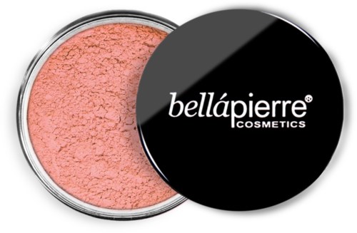 A peach-colored cosmetic powder in a round silver container with a black lid labeled 'bellápierre COSMETICS'.