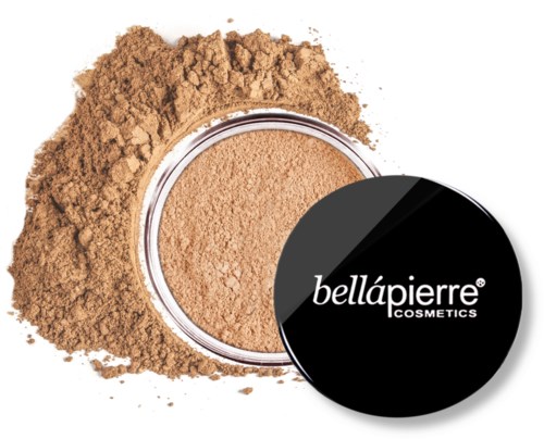 A round container of beige powder with loose powder spilled around it. The lid says Bellapierre Cosmetics.