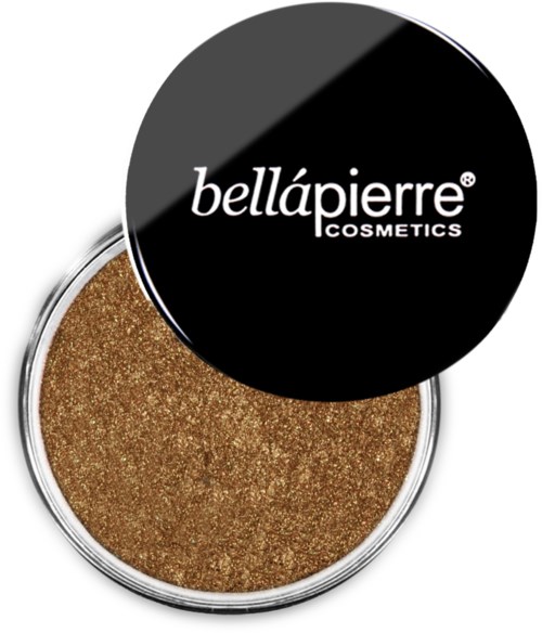 En rund behållare med glittrig guldfärgad makeup och svart lock där det står 'bellápierre COSMETICS'.