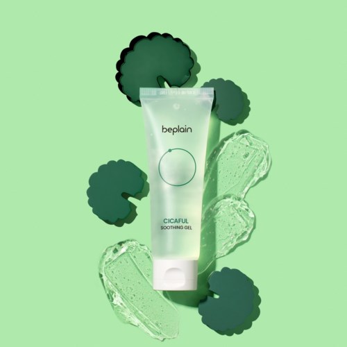 A tube of soothing gel surrounded by ice cubes and green trees or plants on a green background.