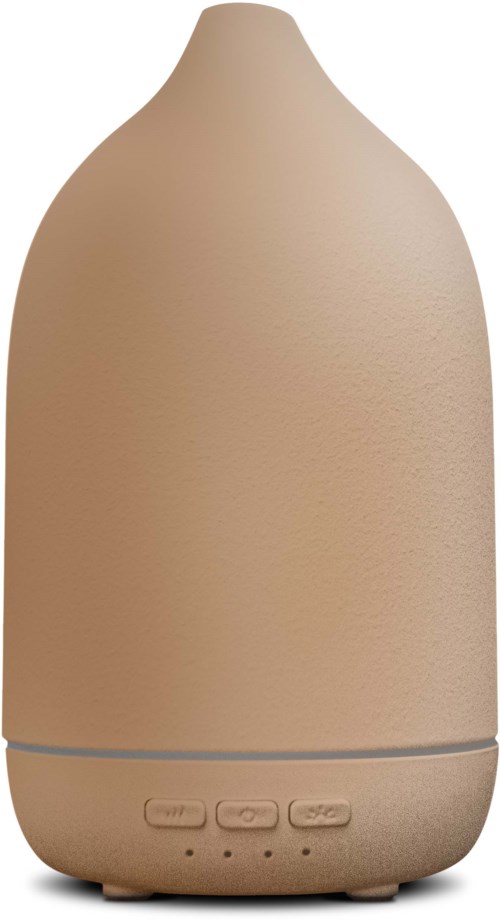 En beige, rund diffuser med kontrollknapper nederst. Den ser ut som en liten luftfukter eller luftrenser.