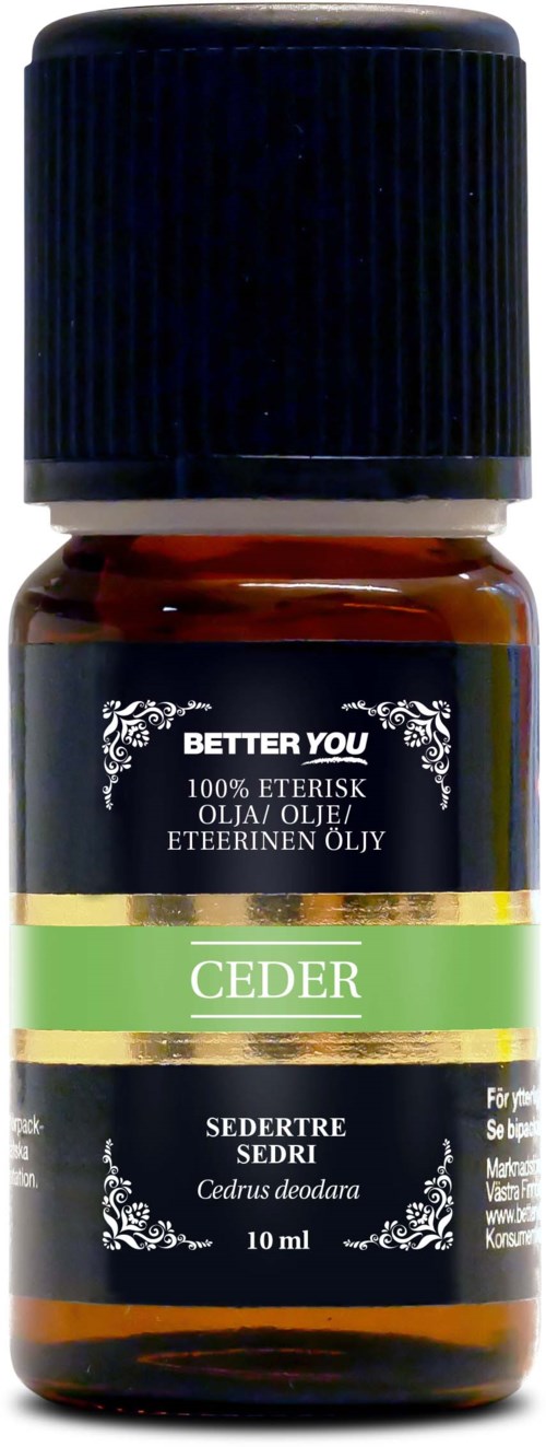 Small amber bottle with a black cap, labeled 'Ceder' and 'Cedrus deodara', cedarwood essential oil.