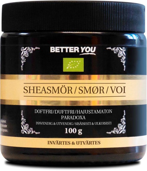 Svart behållare med lock, märkt 'Sheasmör' (shear butter) av BETTER YOU, med grönt lövlogo och dekorativa kanter.