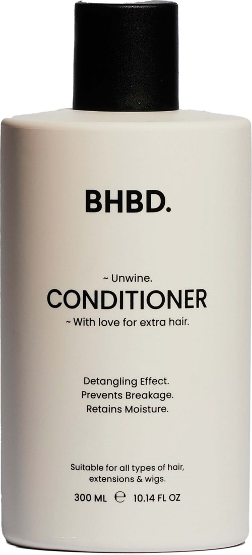 A white bottle with black cap labeled BHBD. Conditioner for extra hair care, detangles, prevents breakage, and retains moisture.