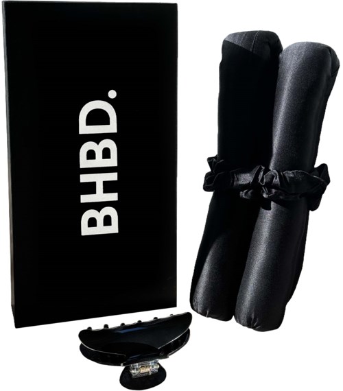 A black box labeled 'BHB.D.' with two black rolled items and a small gadget nearby.