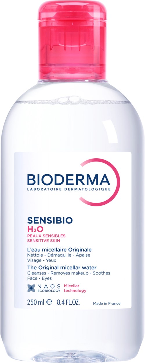 A clear bottle with a pink cap, labeled Bioderma Sensibio H2O, used for cleansing sensitive skin.