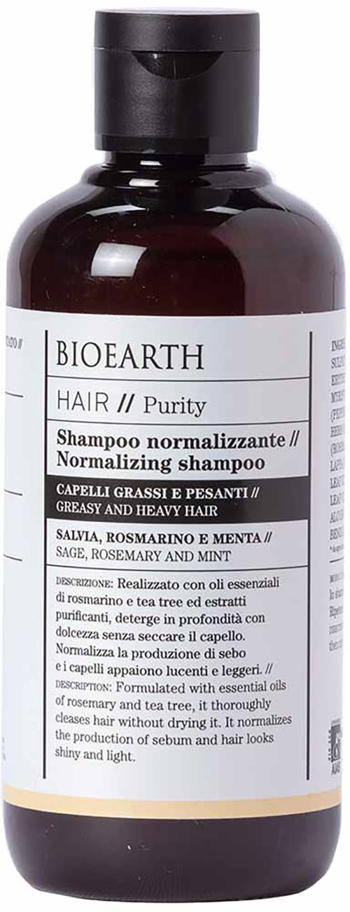 Een bruine fles Bioearth haarshampoo met wit label, zwarte dop en productdetails in meerdere talen.