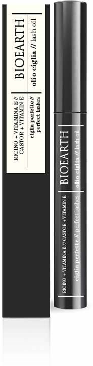 Een zwarte tube en doos met witte labels, bevat bioearth vitamine C en wortelolie serum in een stijlvol ontwerp.