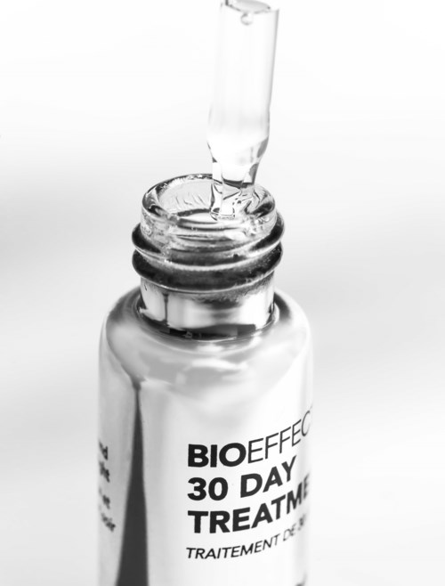 A small glass bottle with a dropper, labeled 'BIO EFFECT 30 DAY TREATMENT.'