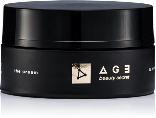 En svart burk märkt 'the cream' med märket 'AGE beauty secret' och symboler på.