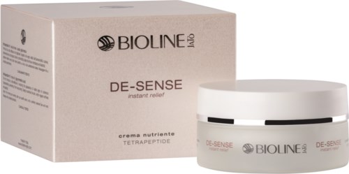En hudvårdsprodukt i vit burk och beige förpackning märkt Bioline IDO De-Sense, för omedelbar lindring med tetrapeptid.