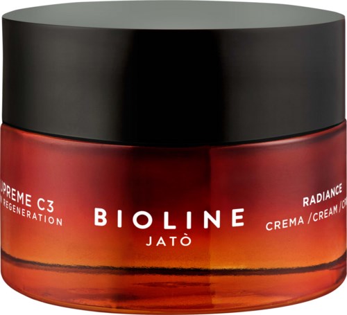 A red cream jar with a black lid labeled Bioline Jatò, Radiance cream for regeneration.