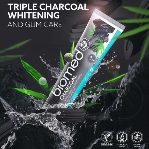 Logo and product packaging with words; features green leaves and water splash design, advertising charcoal whitening and gum care.