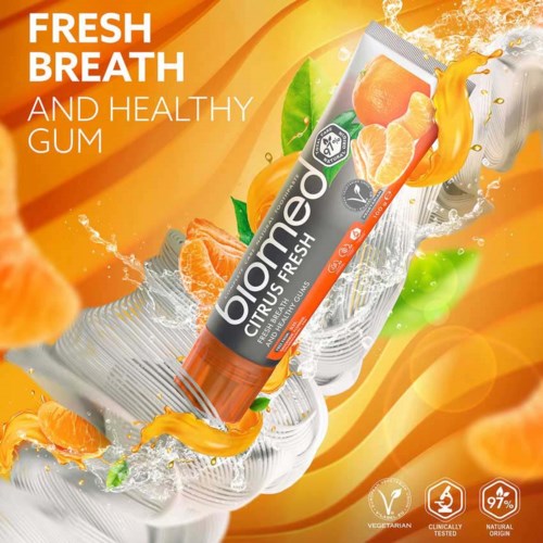 A citrus-flavored chewing gum poster with orange and green accents, showing the gum tube and splashes of juice.