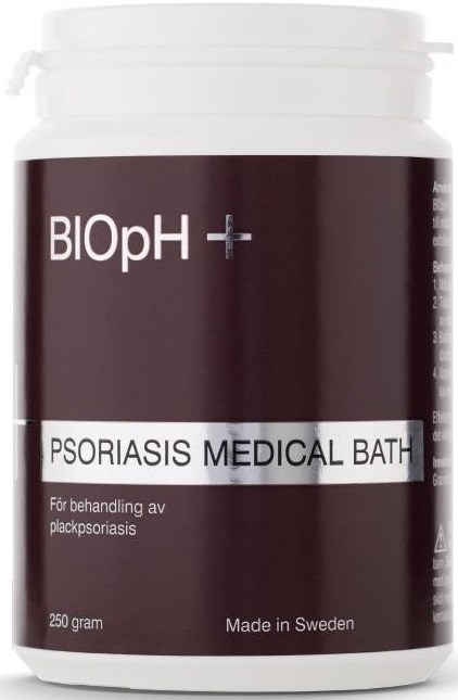 En vit burk med en mörk etikett som säger 'BIOpH+ PSORIASIS MEDICAL BATH' för hudbehandling. 250 gram tillverkad i Sverige.