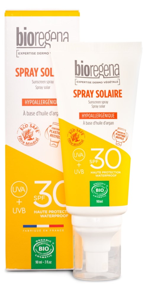 Eine Tube Sonnencremespray mit grünen und gelben Etiketten und Sonnenschutzinformationen.
