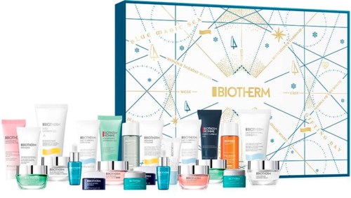 Een set huidverzorgingsproducten met een decoratieve doos, inclusief crèmes, serums en reinigers in verschillende kleuren.