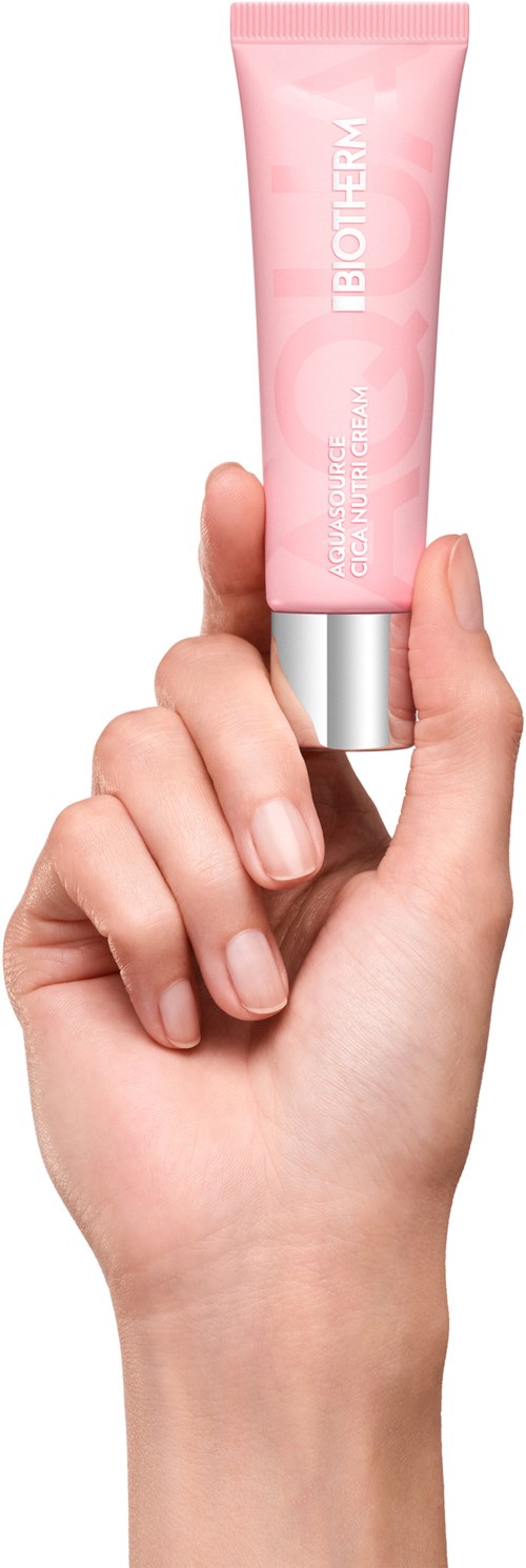 A hand holds a pink tube labeled 'BIOTHERM' and 'GEL CREME' with a silver cap.