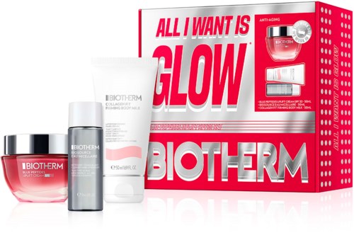 Sett med hudpleieprodukter med en rød og hvit Biotherm-eske som sier alt jeg vil ha er glød, inkludert krem, serum og gel.