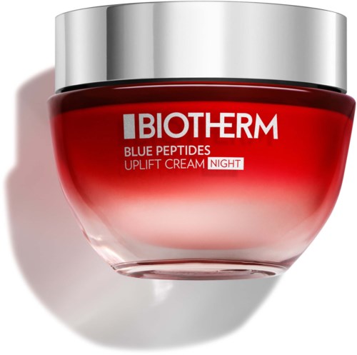 The jar is red with silver lid, labeled BIOTHERM, and offers night cream with blue peptides for skin uplift.