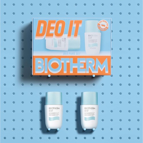 Biotherm ihonhoitotuotteet sinisillä kansilla ja detox-setin mainostava laatikko, taustalla sininen pilkkupinta.