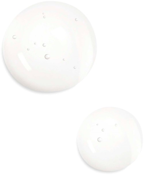 Twee witte tabletten met kleine gaten liggen op een eenvoudige witte achtergrond.