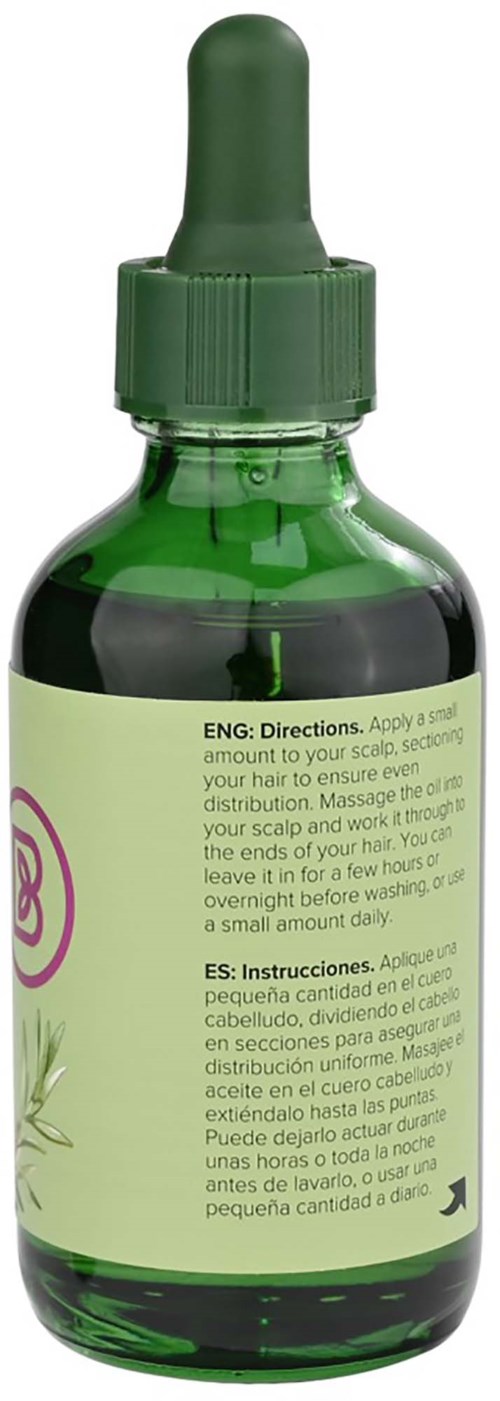 A green glass dropper bottle with instructions on the label for hair care and scalp massage.