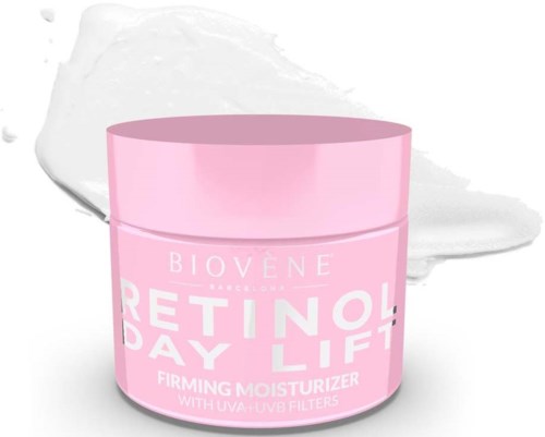 Pink jar labeled 'Retinol Day Lift' indicating a moisturizer for skin. Background has a white patch and a gray streak.