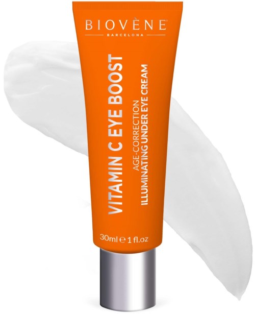 Eine leuchtend orangefarbene Tube mit Biovène Vitamin-C-Augencreme mit weißen Text, auf weißem Hintergrund.